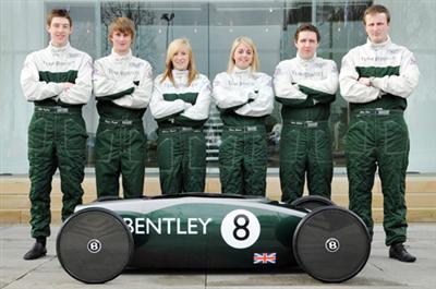 Bentley Greenpower car with six of the nine team members