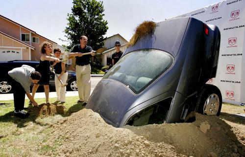 The Rosenfeld family bury their 1998 Toyota Camry
