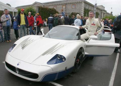 Martin Leach, Maserati's CEO 
with the new Maserati MC12 
at the Goodwood Week of Speed, 2004