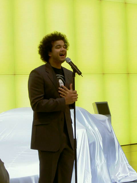 Guy Sebastian
singing 'Angels Brought Me Here' on the Mazda stand
at the 2004 Australian International Motor Show