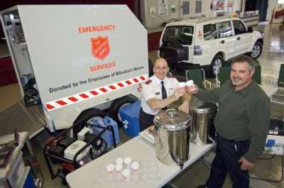 The Salvation Army's new Mitsubishi Pajero and trailer 
with Captain Robert Evans (left) and Bill Greene (right)