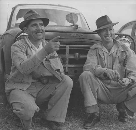 1956 Ampol Trial winners 
Alan Taylor and 
Wilf Murrell in front 
of their winning 
Peugeot 403