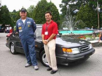 Peter Gilbert, left, and Saab USA General Manger Jay Spenchian, right, savour the 
moment as Gilbert's 1989 Saab 900 SPG, background, reaches the one million 
milestone at this year's North American Saab Owners Convention in Lake George, 
N.Y