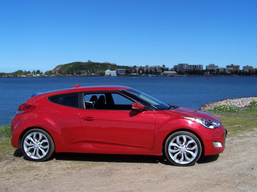 www.nextcar.com.au (copyright image) - Hyundai Veloster finished in Veloster Red - 2012 - Australia