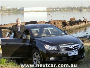 Stephen Walker with the 
Holden Cruze (copyright image)